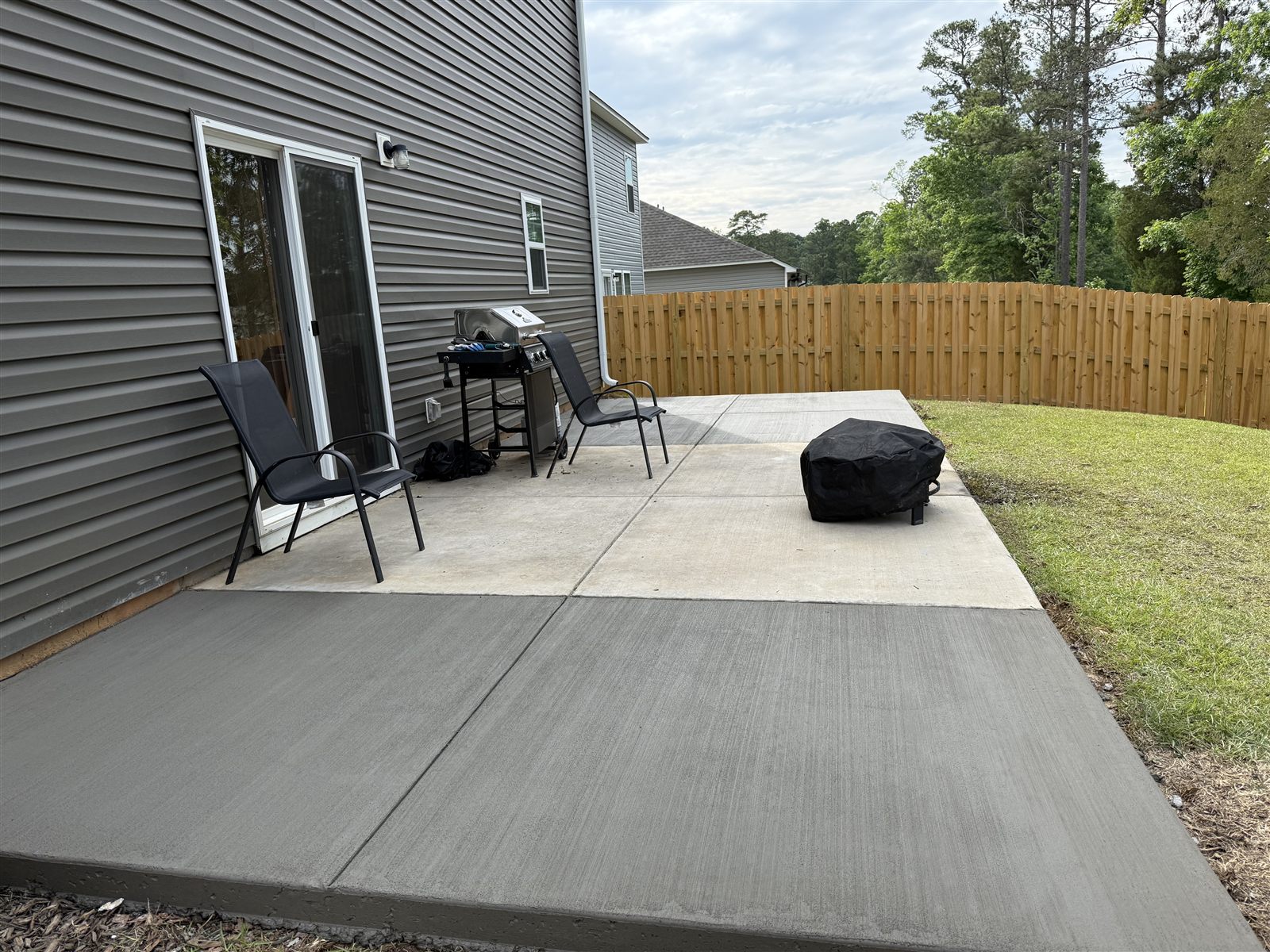 Finished backyard patio with seating and grill, Columbia SC